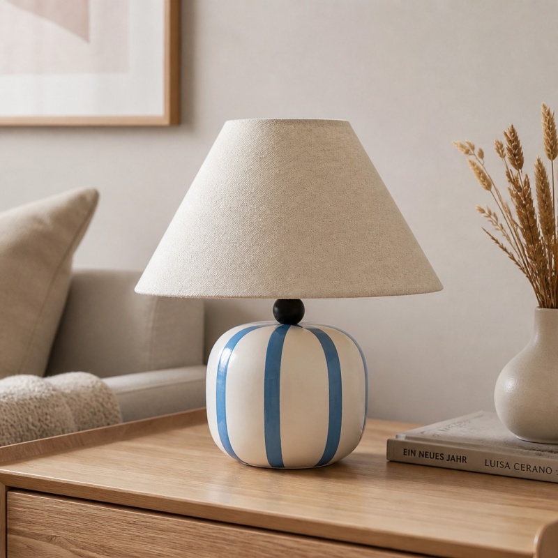 Ceruna table lamp on a bedside table with soft decor