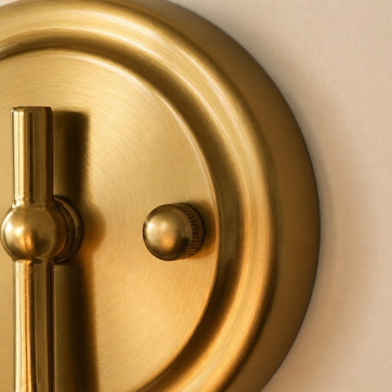 Close view of brass wall plate and switch detail