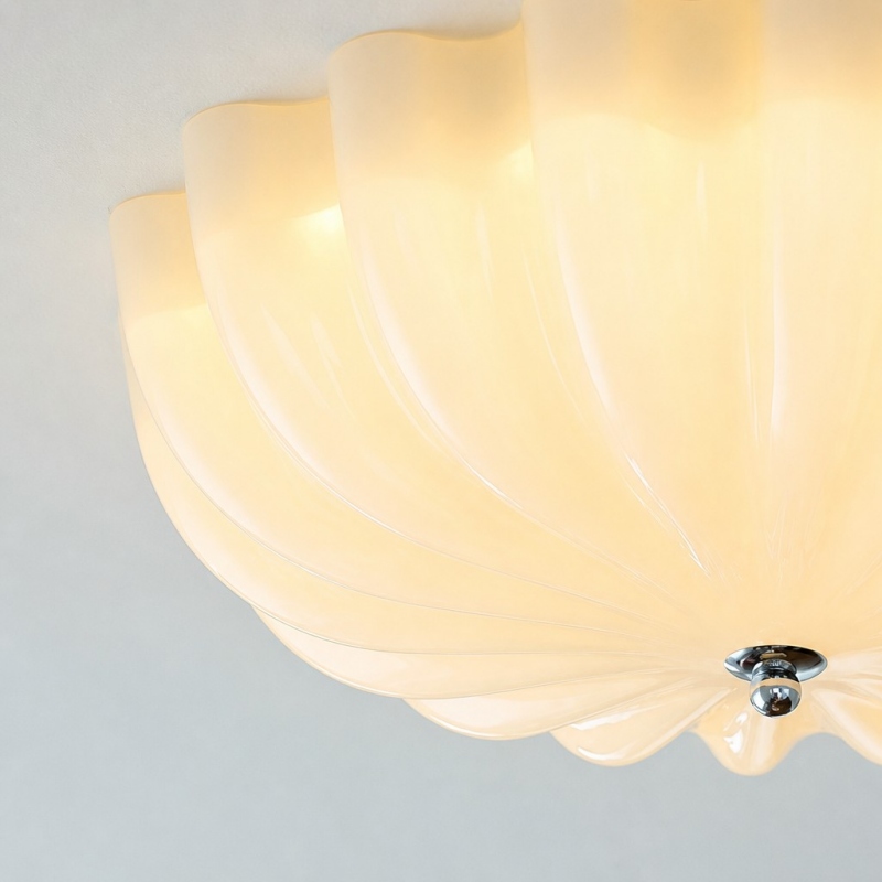 Close view of the glowing cream floral glass shade