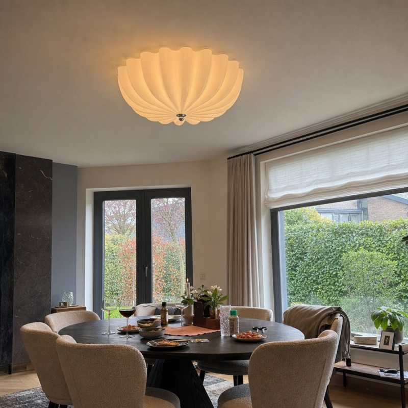Customer dining room photo with warm Durnic ceiling light