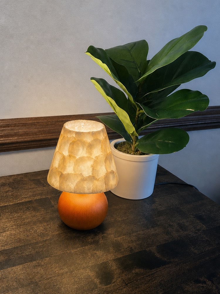 Beamira lamp casting a warm glow in a room