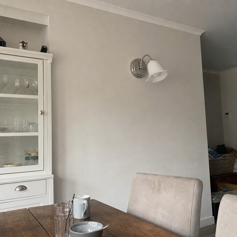 Customer room photo with wall lamp