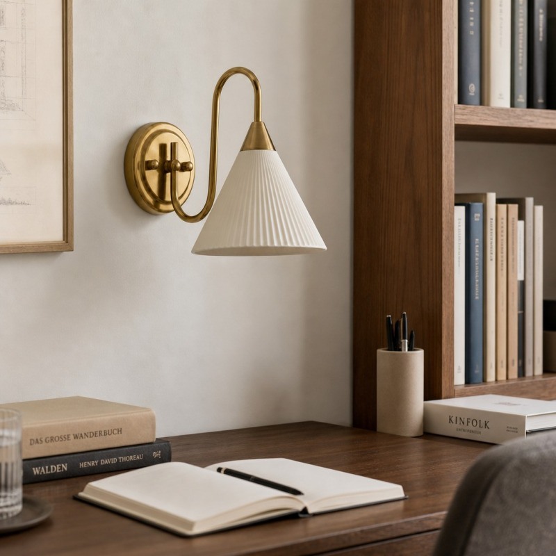 Vintage wall lamp beside a desk