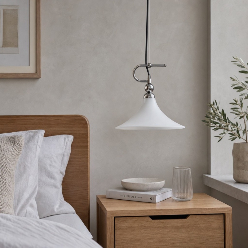 Magnolia pendant light beside a bed