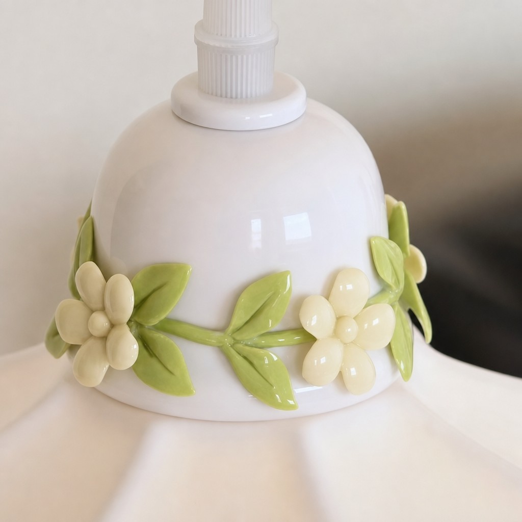 Close-up of ceramic floral detail on the pendant lamp