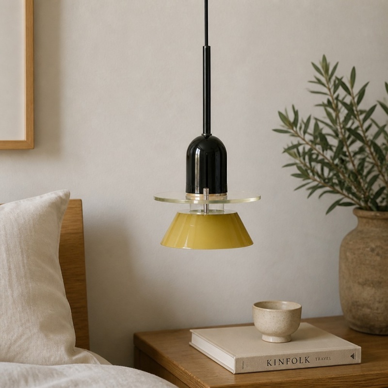 Moxellan pendant light in yellow above a bedside table