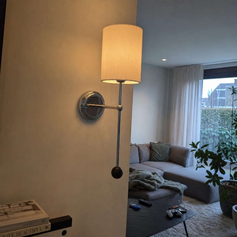 Customer photo of the Cumoris wall lamp glowing at home