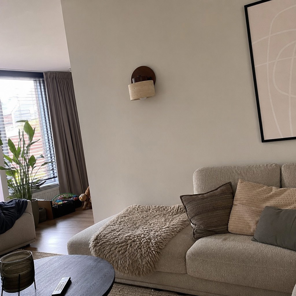 Customer photo of Travira wall lamp near a sofa