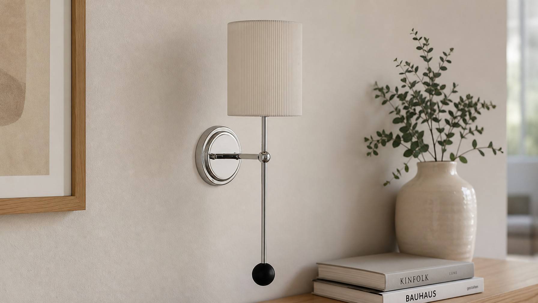 Cumoris pleated wall lamp styled beside books and a vase