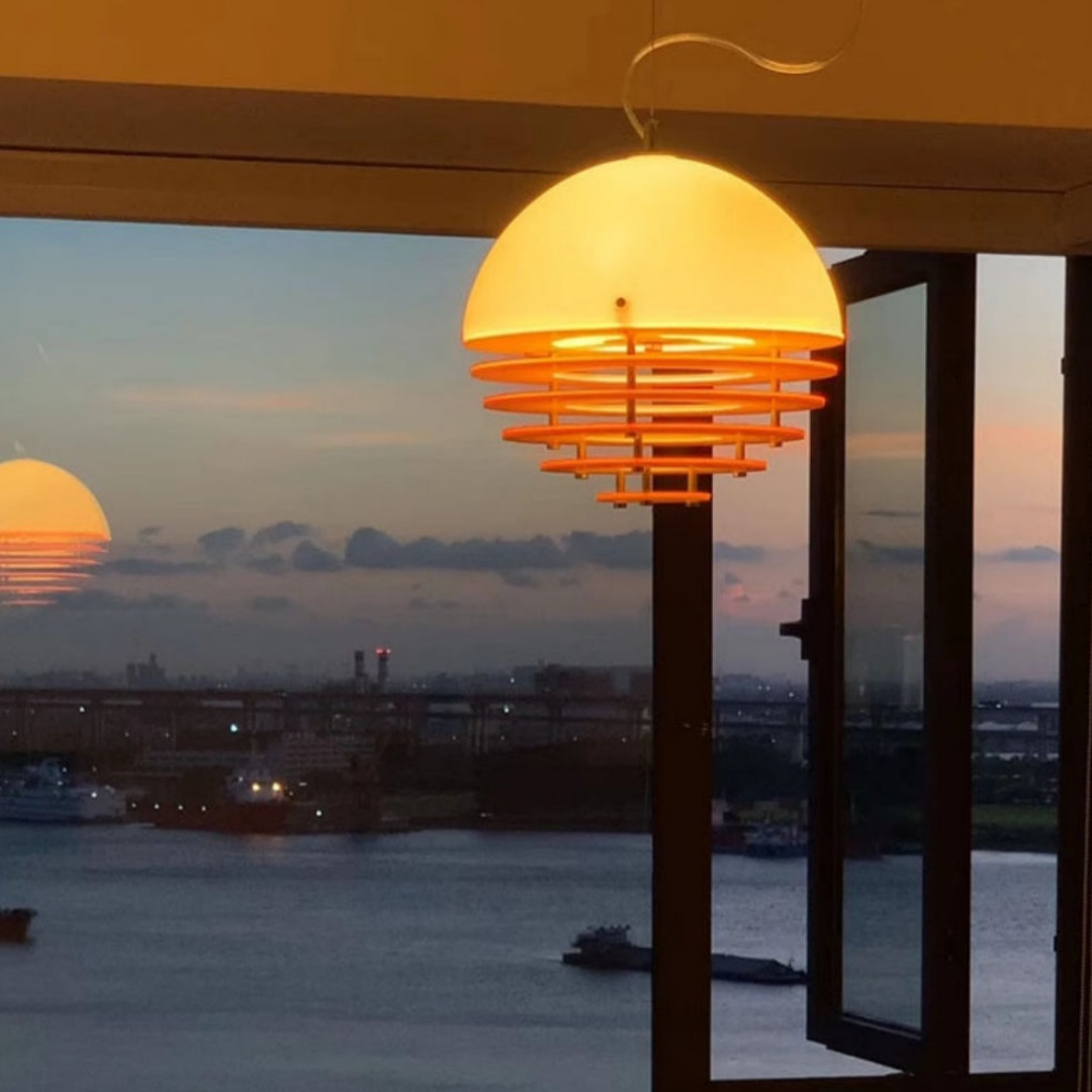 Sunset Pendant Light by a window at sunset