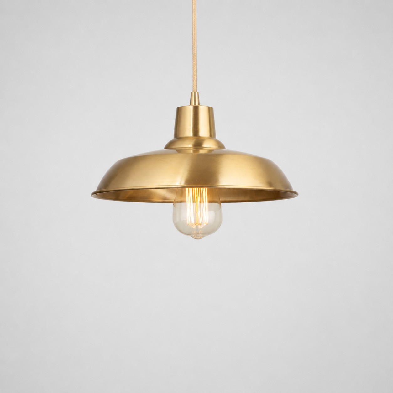 Brushed brass disc pendant light product view