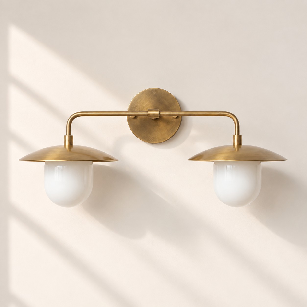Frosted White Glass Globe — Brass-Finish Wall Sconce — A natural perspective