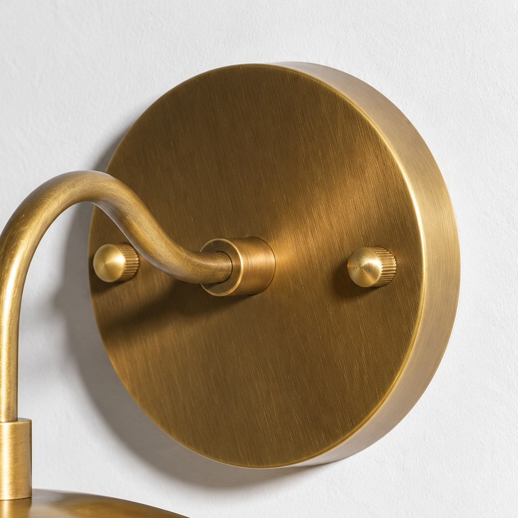 Frosted White Glass Globe — Brass-Finish Wall Sconce — A natural perspective