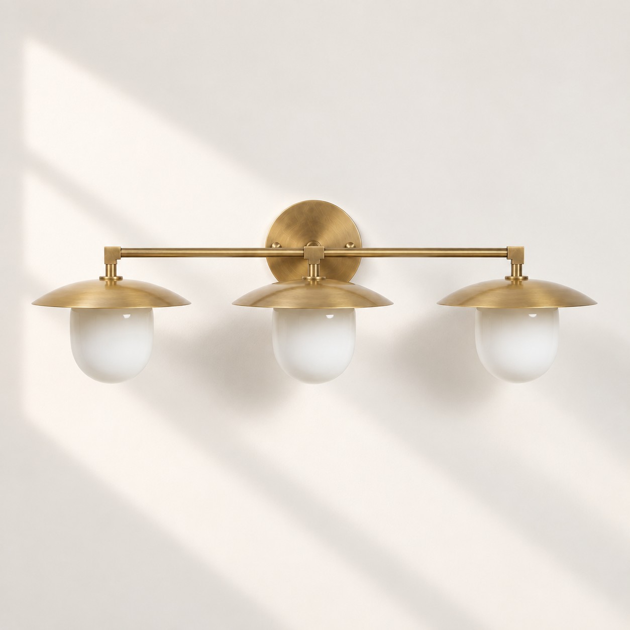 Frosted White Glass Globe — Brass-Finish Wall Sconce — A natural perspective