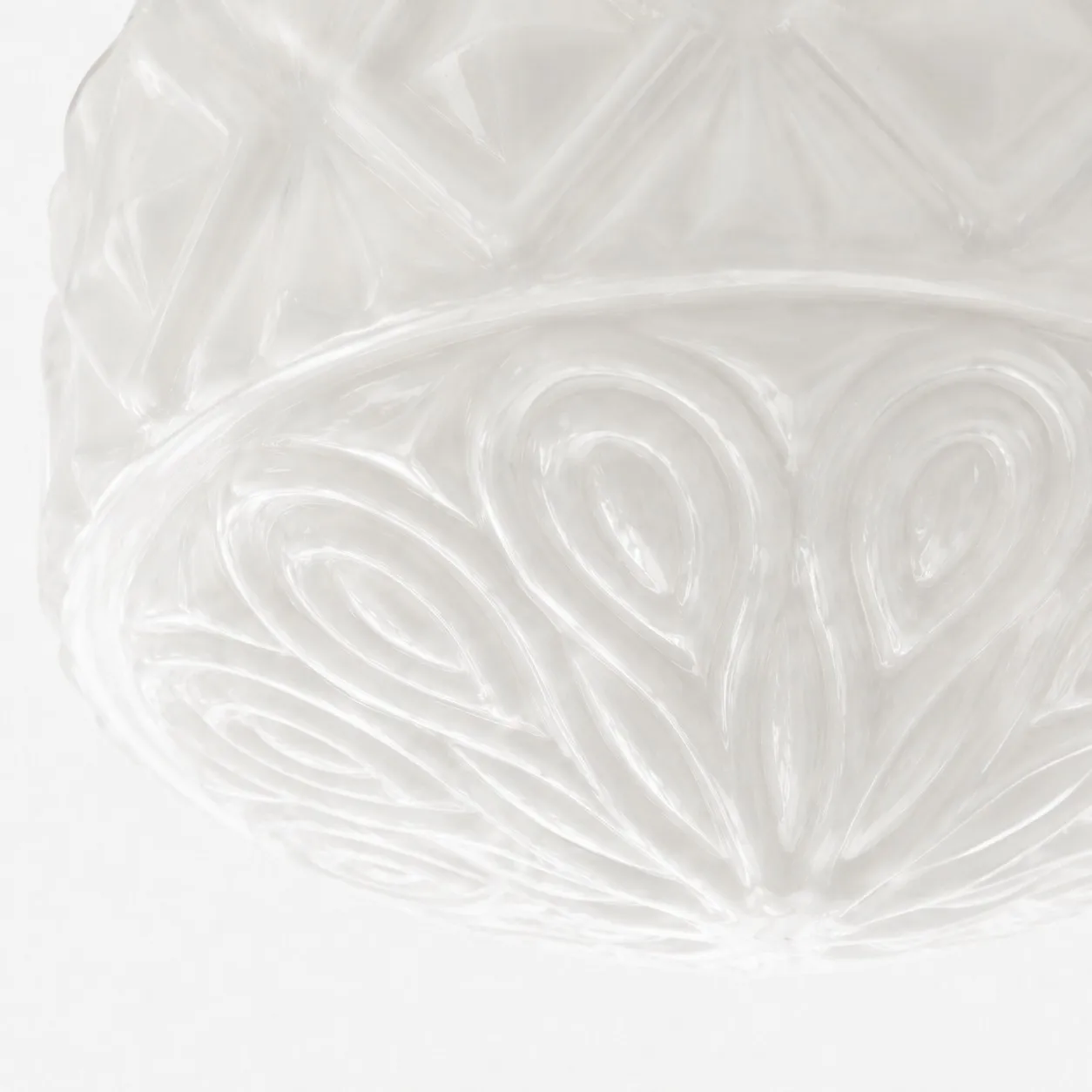 Milky glass floral relief detail on ceiling light