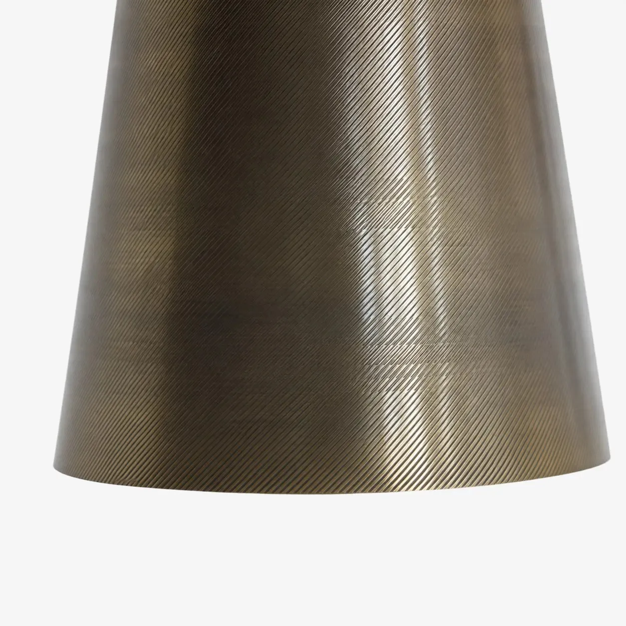 Close-up of the hand-carved brass texture