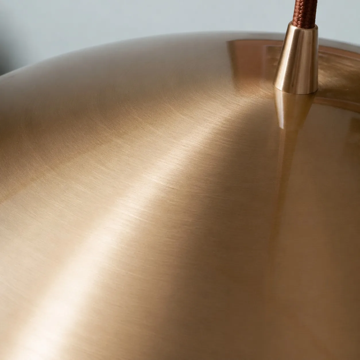 Close-up of the copper dome shade and suspension fitting